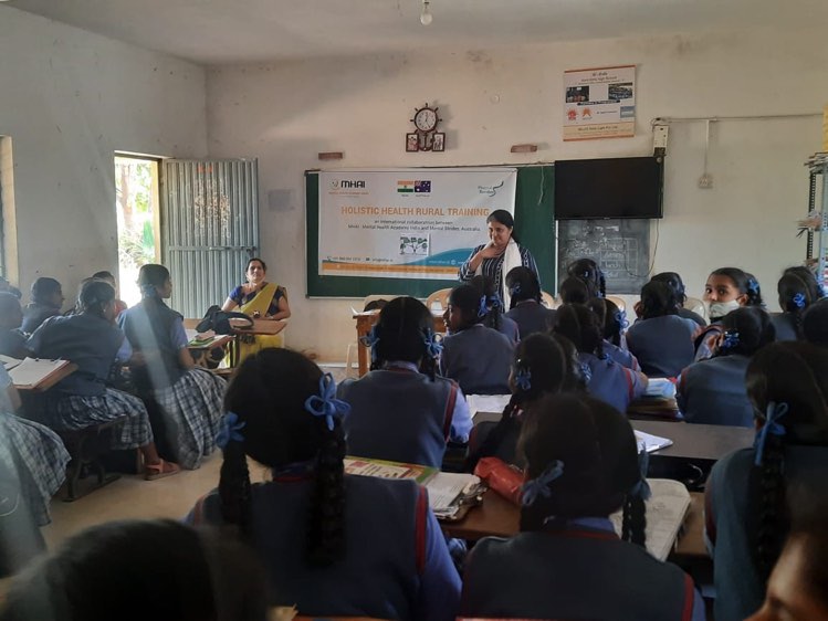 A Holistic Health trainer delivers training to female students participants in India.